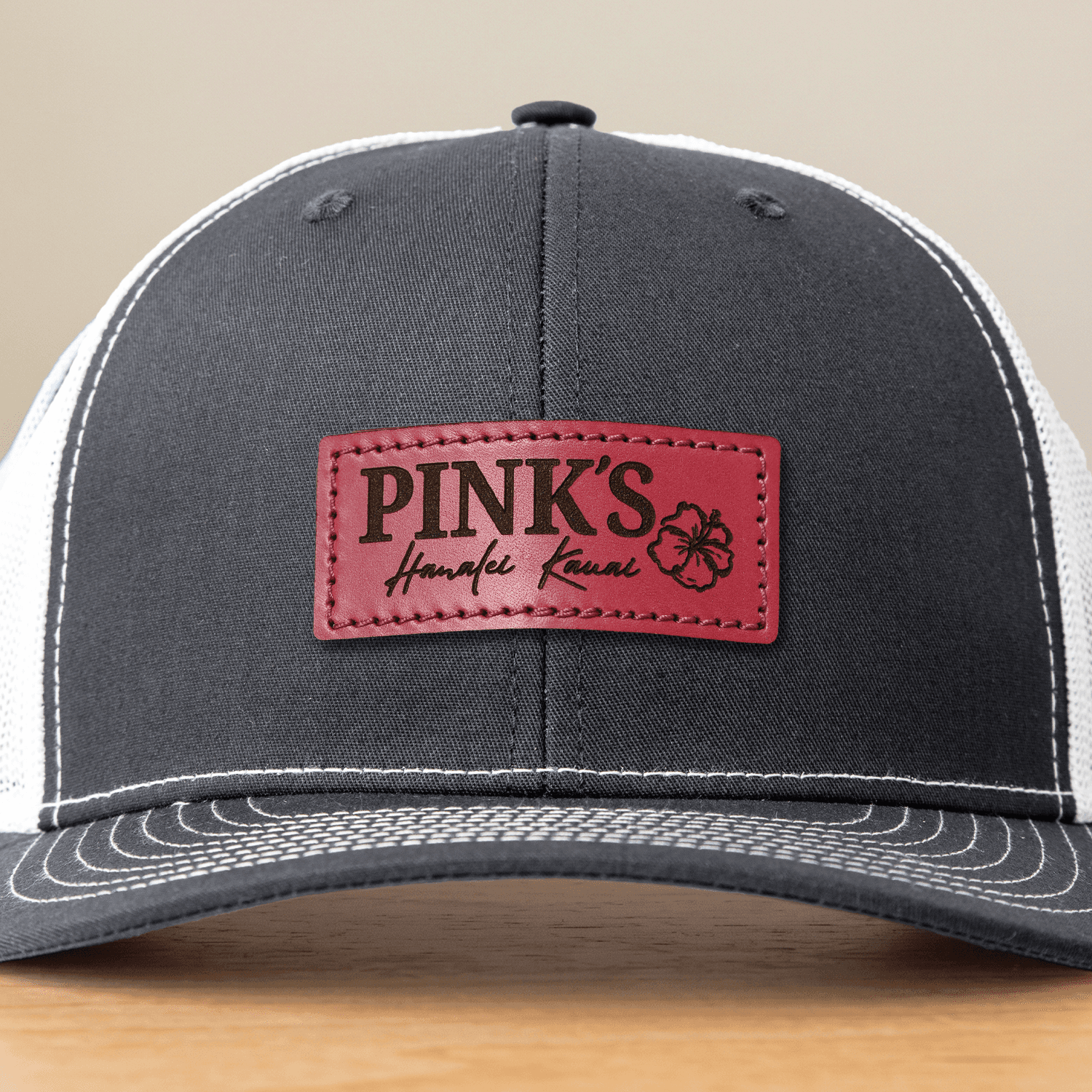 Image shows an example of the mustard leather patch color stitched onto a beanie.