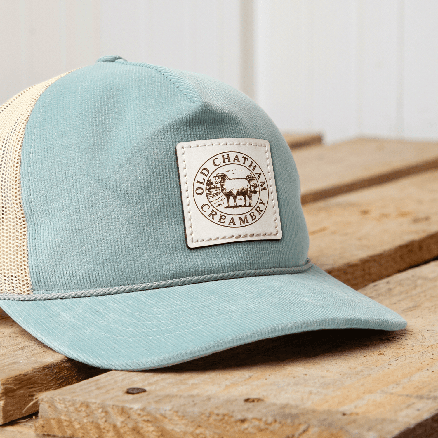 Image shows an example of the mustard leather patch color stitched onto a beanie.