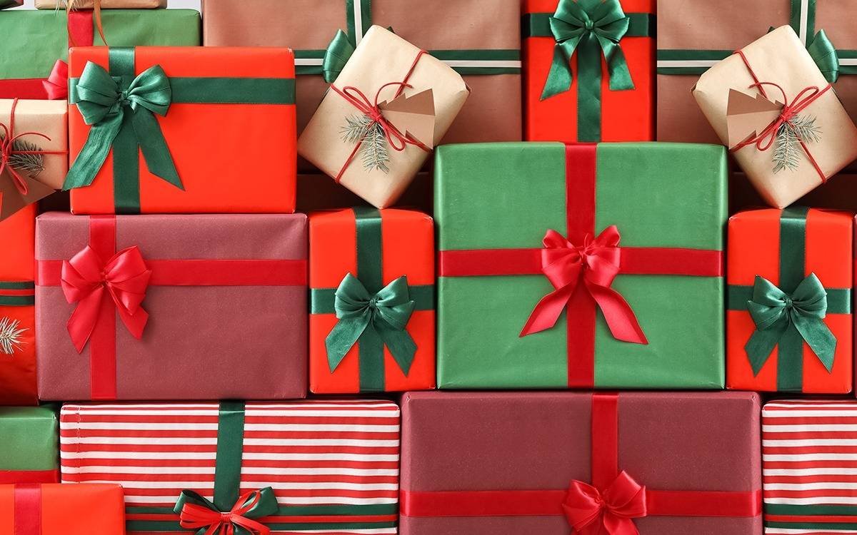 stacks of Christmas presents wrapped in red and green