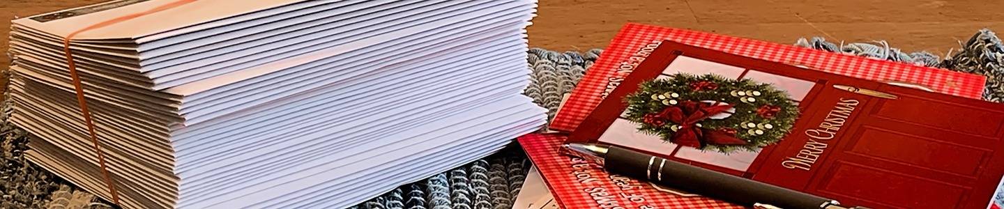 Stack of Christmas cards on table