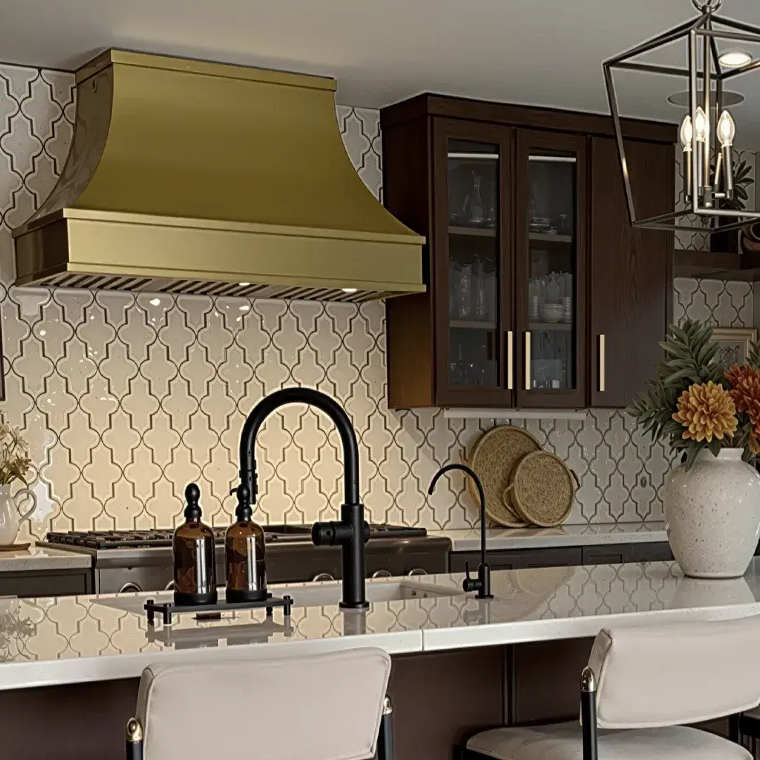 Custom Copper Range Hood against a white tile background