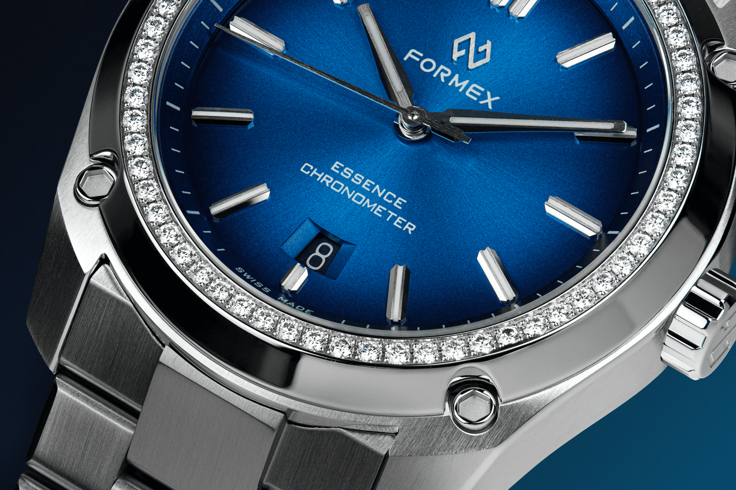 Close-up of a blue Formex Essence with diamond-set bezel