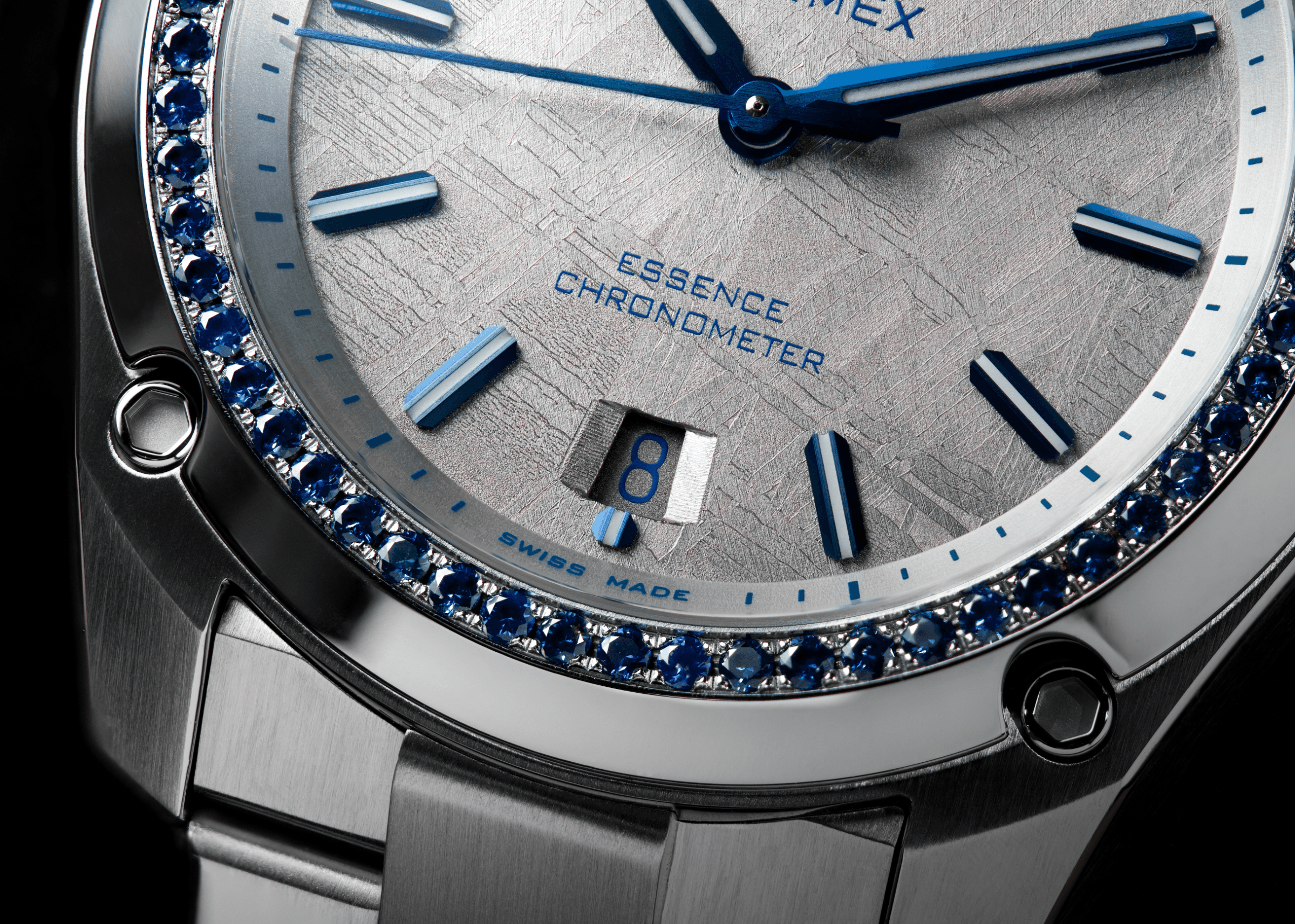 Close-up of a Formex Essence Space Ghost with blue sapphire bezel